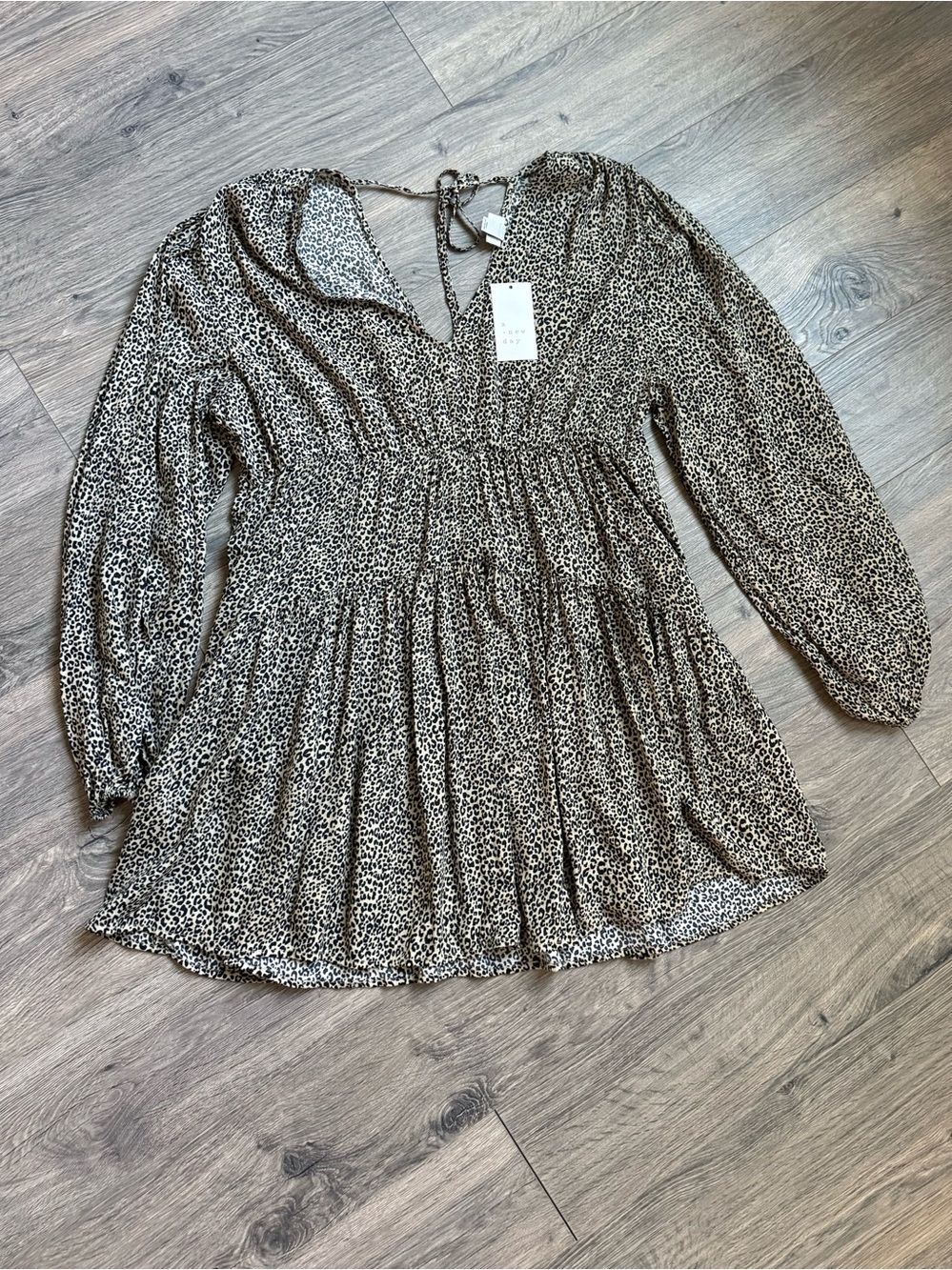A New Day women’s leopard print mini dress featuring a flattering deep V-necklin
